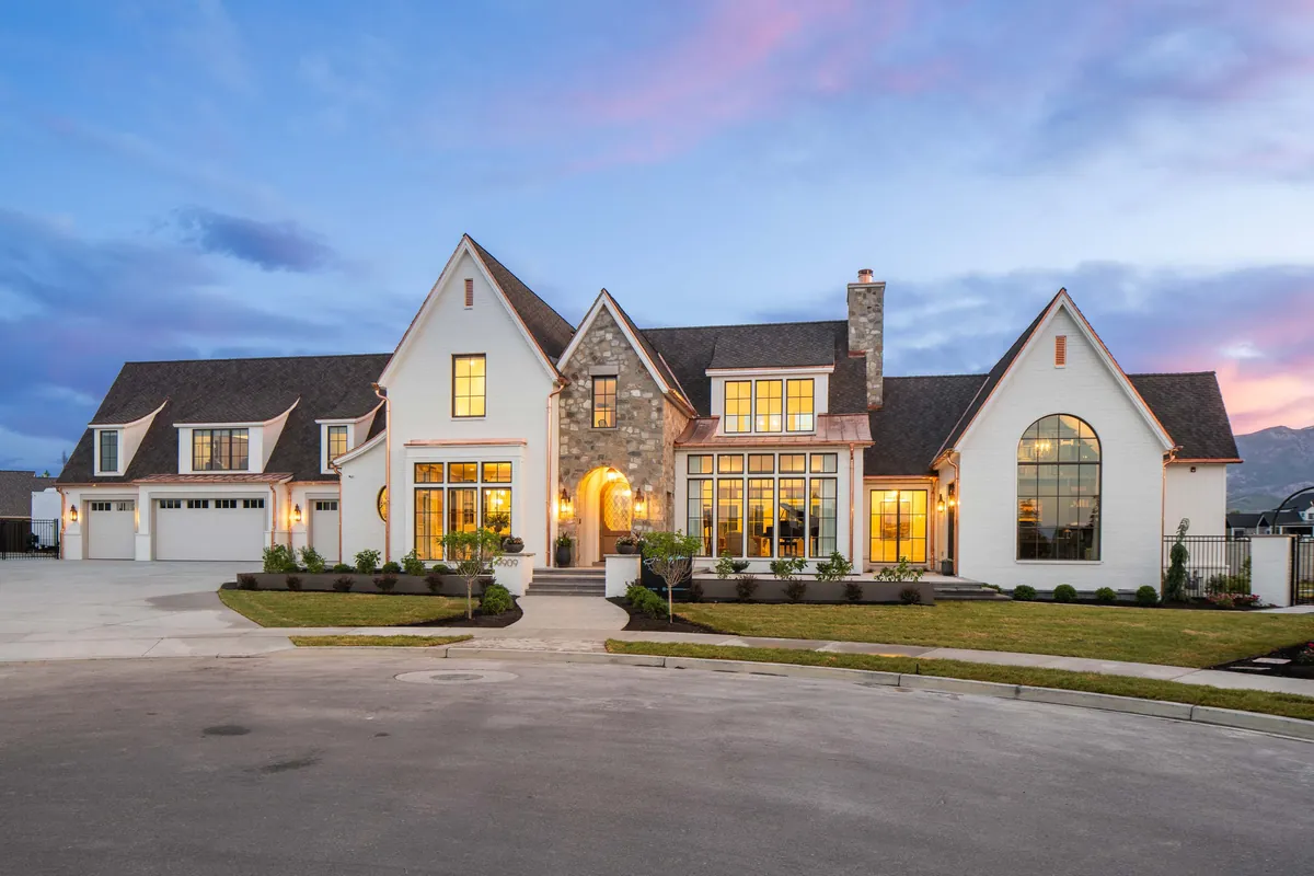 Exterior of a J. Christopher Homes property at dusk in the 2026 Utah Valley Parade of Homes