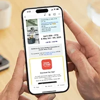 A hand holding a phone displaying a digital Parade of Homes ticket ready to be scanned